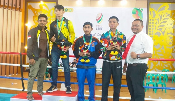 Yukai Prihatin Martin, atlet Muaythai Bireuen berhasil merebut 2 medali emas pada PORA XIV 2022 di Pidie. Saat ini Bireuen peringkat 4 klasemen sementara. Foto: Humas.