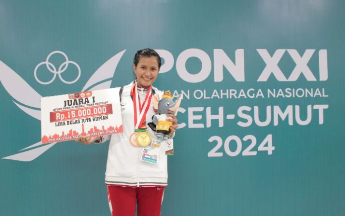 Angela merici (1) Dapat Medali Emas, Atlet Menembak DKI Angela Pingsan Atlet menembak DKI Jakarta Angela Merici Virginia Henan pingsan usai diumumkan sebagai pemenang kategori 10 meter air pistol putri PON XXI Aceh-Sumut. Foto: KONI Jakarta.