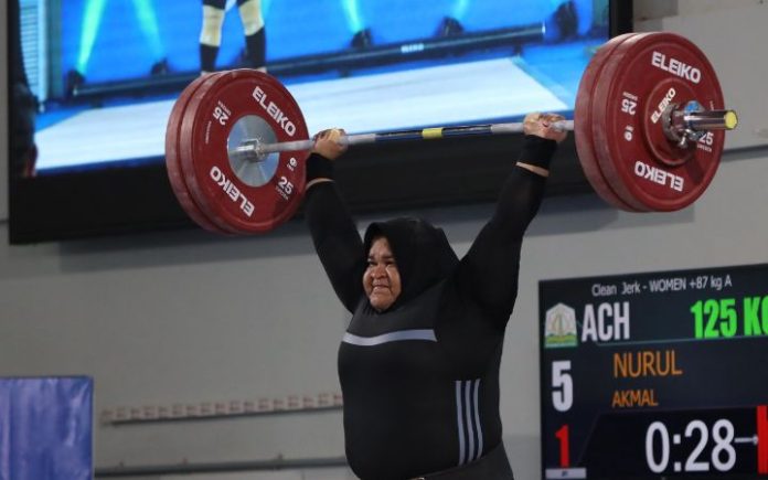 Pecahkan Rekor, Nurul Akmal Raih Emas PON XXI 2024 Lifter internasional asal Aceh, Nurul Akmal. Foto: Komparatif.ID.