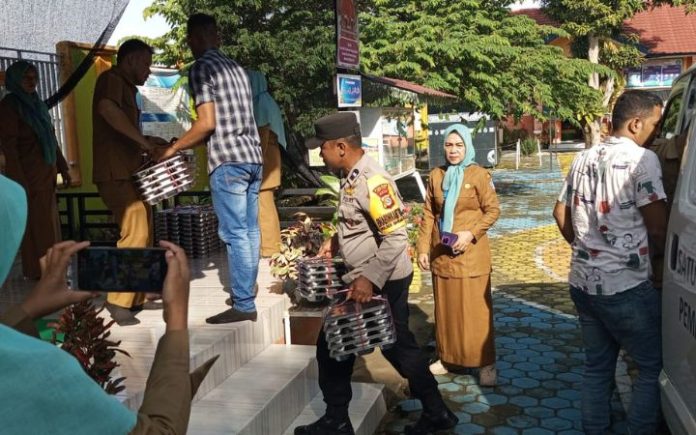 MBG Pidie Jaya Polisi Kawal Pembagian MBG untuk 1.993 Pelajar di Bandar Baru